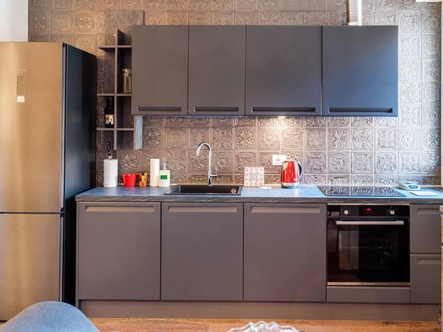 Kitchen or kitchenette, dishwasher, oven, stove