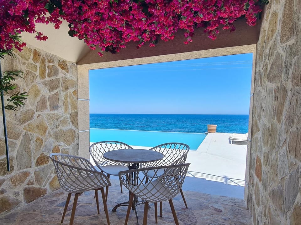 View (from property/room), Balcony/Terrace, Seating area, Pool view, Sea view