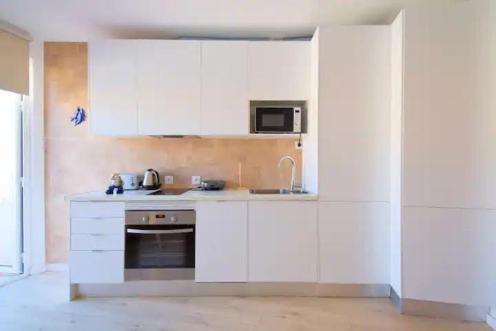 Kitchen or kitchenette, oven, stove, toaster