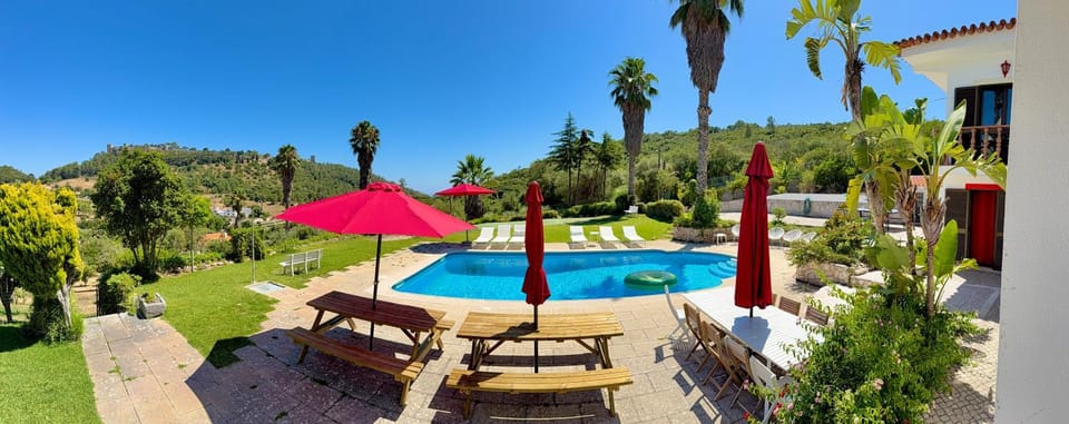 Property building, Nearby landmark, Natural landscape, Garden, Landmark view, Swimming pool, sunbed
