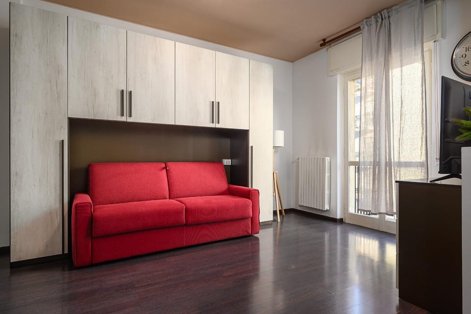Bed, TV and multimedia, Living room, Seating area, air conditioner