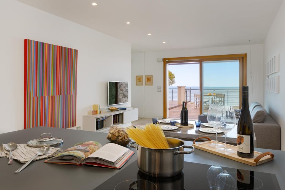 View (from property/room), Kitchen or kitchenette, Living room, Seating area, Dining area, Sea view