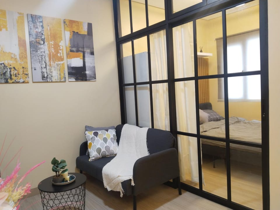 Bed, Living room, Seating area, Bedroom