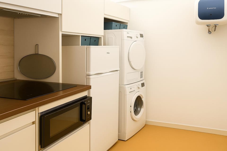 Kitchen or kitchenette, dishwasher, oven, washing machine, dryer