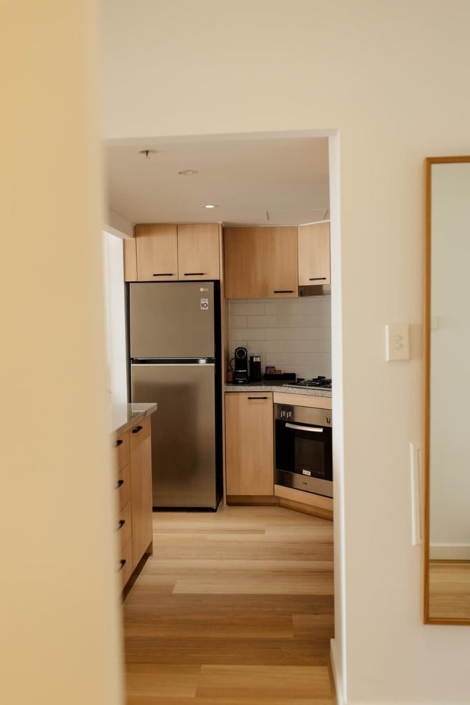 Kitchen or kitchenette, dishwasher, oven, stove
