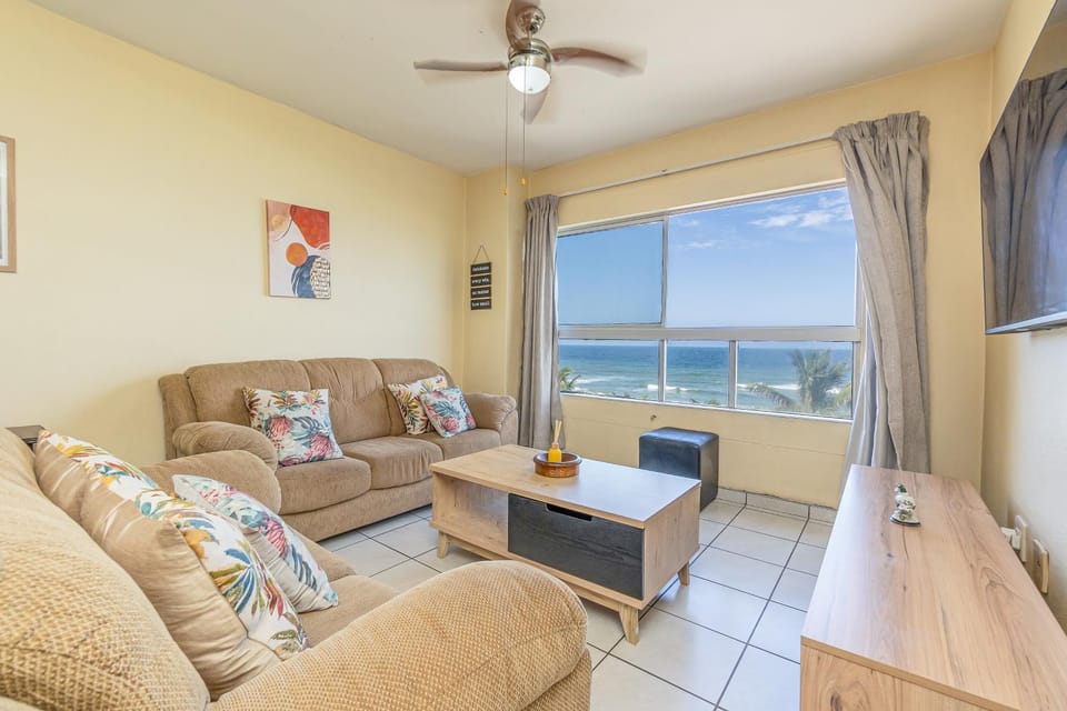 Natural landscape, View (from property/room), Living room, Seating area, Sea view, fireplace