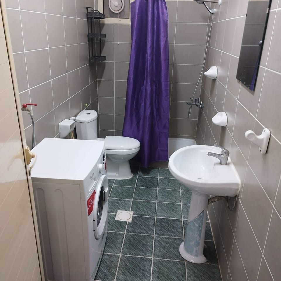 Shower, Toilet, Bathroom, bidet, towels, washing machine, dryer
