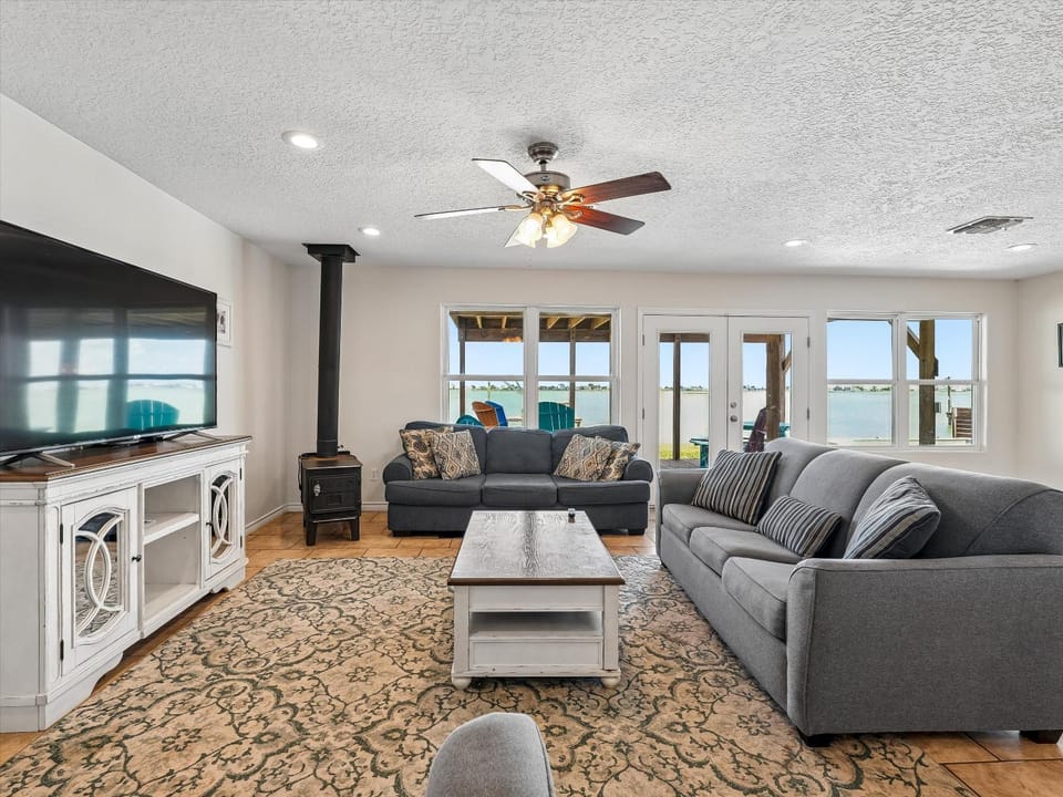 View (from property/room), Living room, Seating area, Lake view, furniture