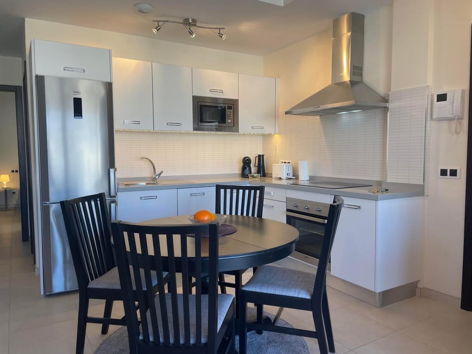 Kitchen or kitchenette, Seating area, Dining area, dishwasher, oven, stove, toaster, kitchen