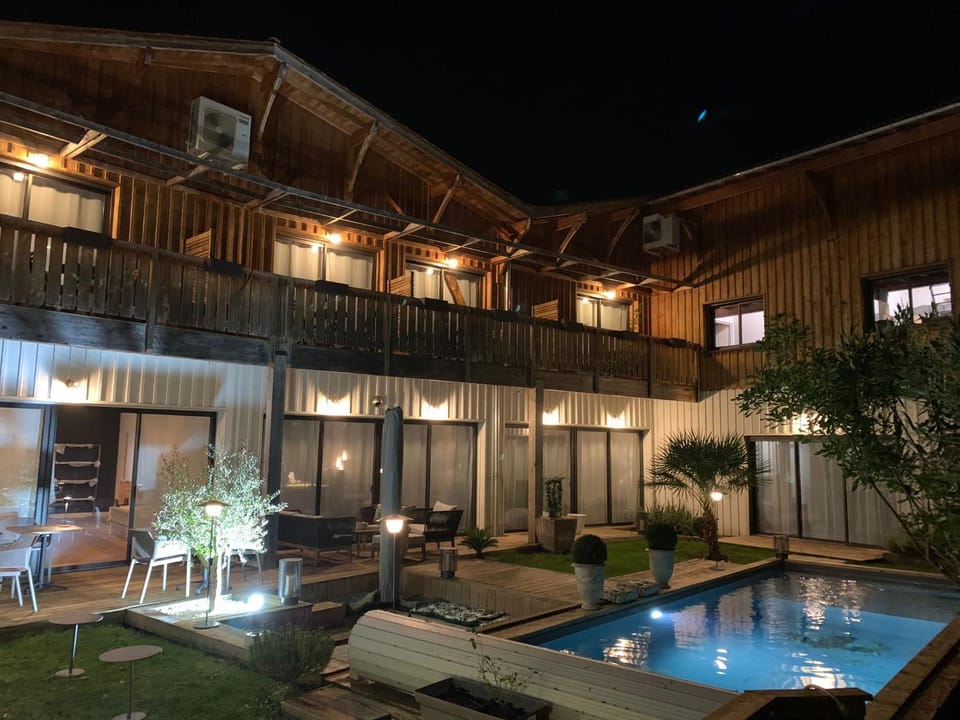 Property building, Patio, Night, Garden, Garden view, Pool view, Swimming pool