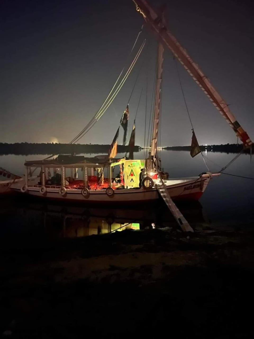 Aswan Felucca sailing boat and Hotel Docked boat in Red Sea Governorate