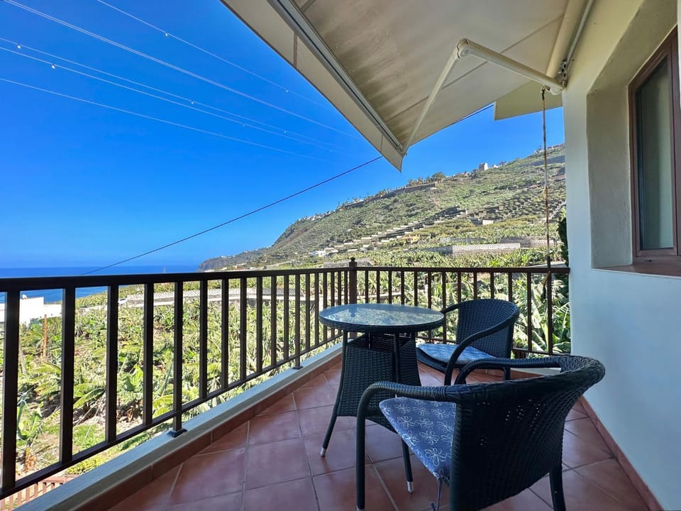 View (from property/room), Balcony/Terrace, Seating area, Mountain view, Pool view, Sea view
