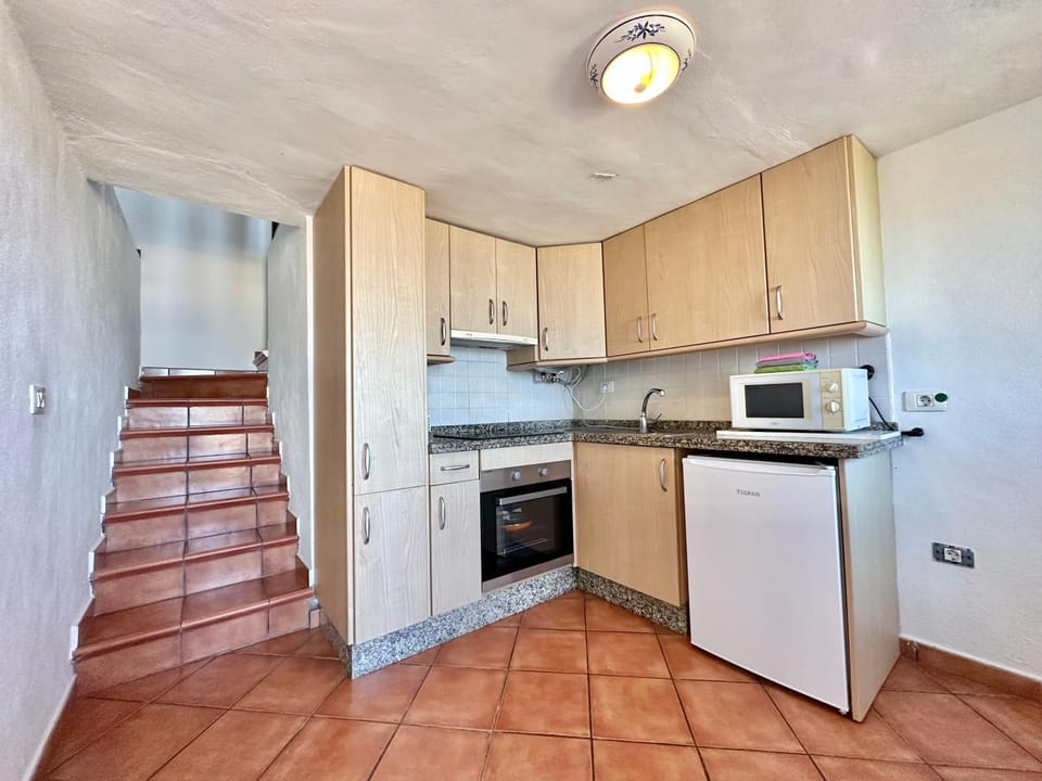 Kitchen or kitchenette, microwave, oven, stove, kitchen
