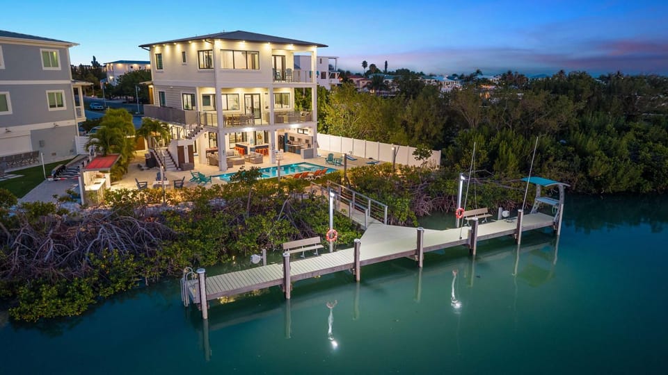 Luxury Seaside Escape ~ Heated Pool w Jacuzzi ~ Elevator ~ Dock ~ Scenic Views House in Key Colony Beach