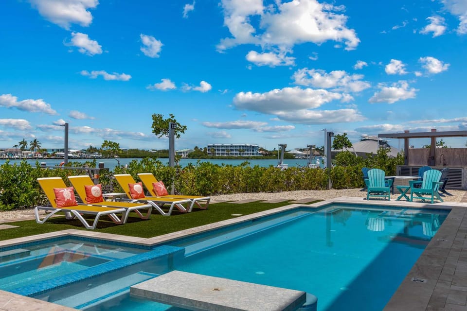 Luxury Seaside Escape ~ Heated Pool w Jacuzzi ~ Elevator ~ Dock ~ Scenic Views House in Key Colony Beach