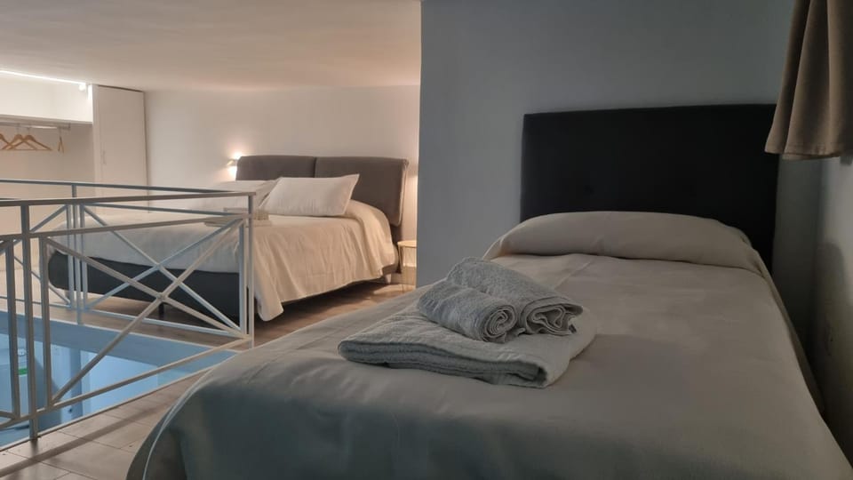 Bed, Photo of the whole room, Decorative detail, Bedroom, towels, wardrobe
