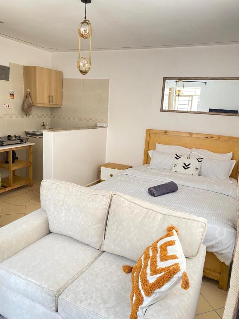 Bed, Kitchen or kitchenette, Seating area
