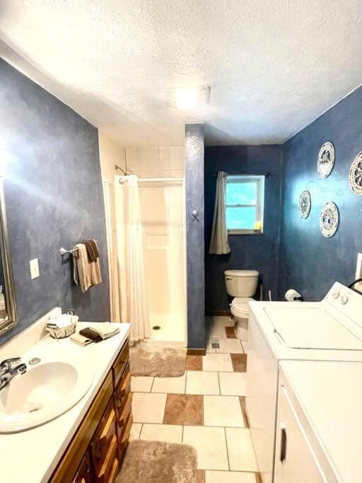Shower, Toilet, towels, washing machine, dryer