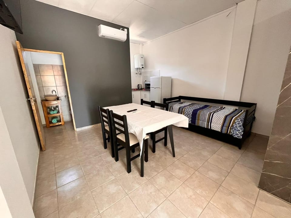 Bed, Living room, Seating area, Dining area