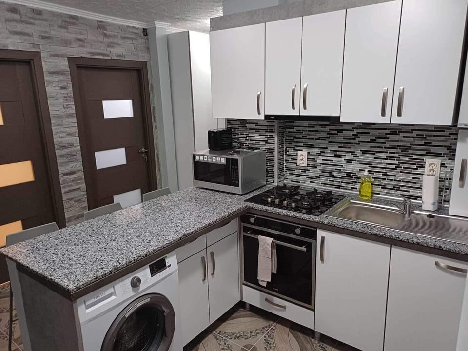 Kitchen or kitchenette, washing machine