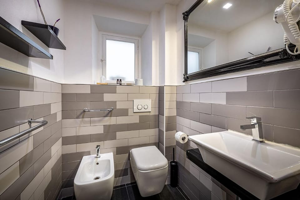 Toilet, Bathroom, bidet, hair dryier, towels