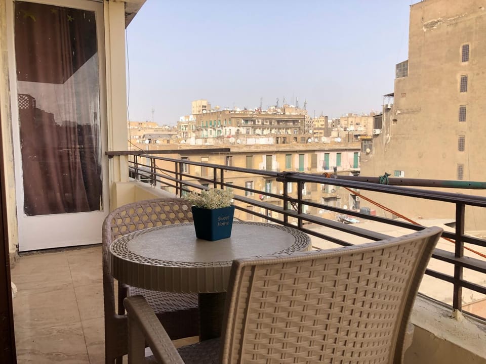 Property building, Patio, Day, View (from property/room), Balcony/Terrace, Living room, Seating area, Dining area, City view