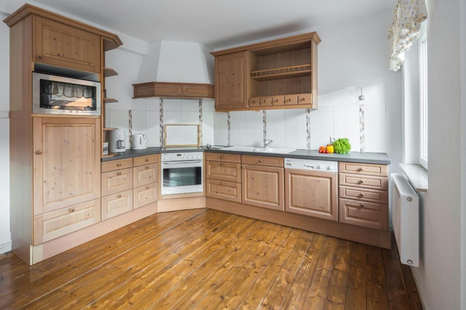 Kitchen or kitchenette, dishwasher, oven, stove