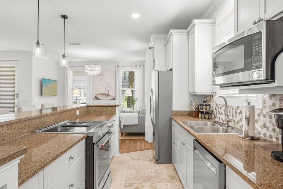 Kitchen or kitchenette, dishwasher, microwave, oven, stove