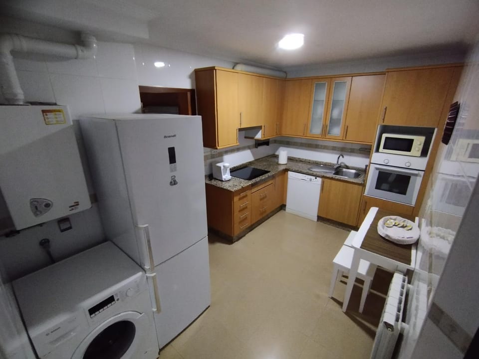 Kitchen or kitchenette, dishwasher, oven, stove, toaster, washing machine, dryer
