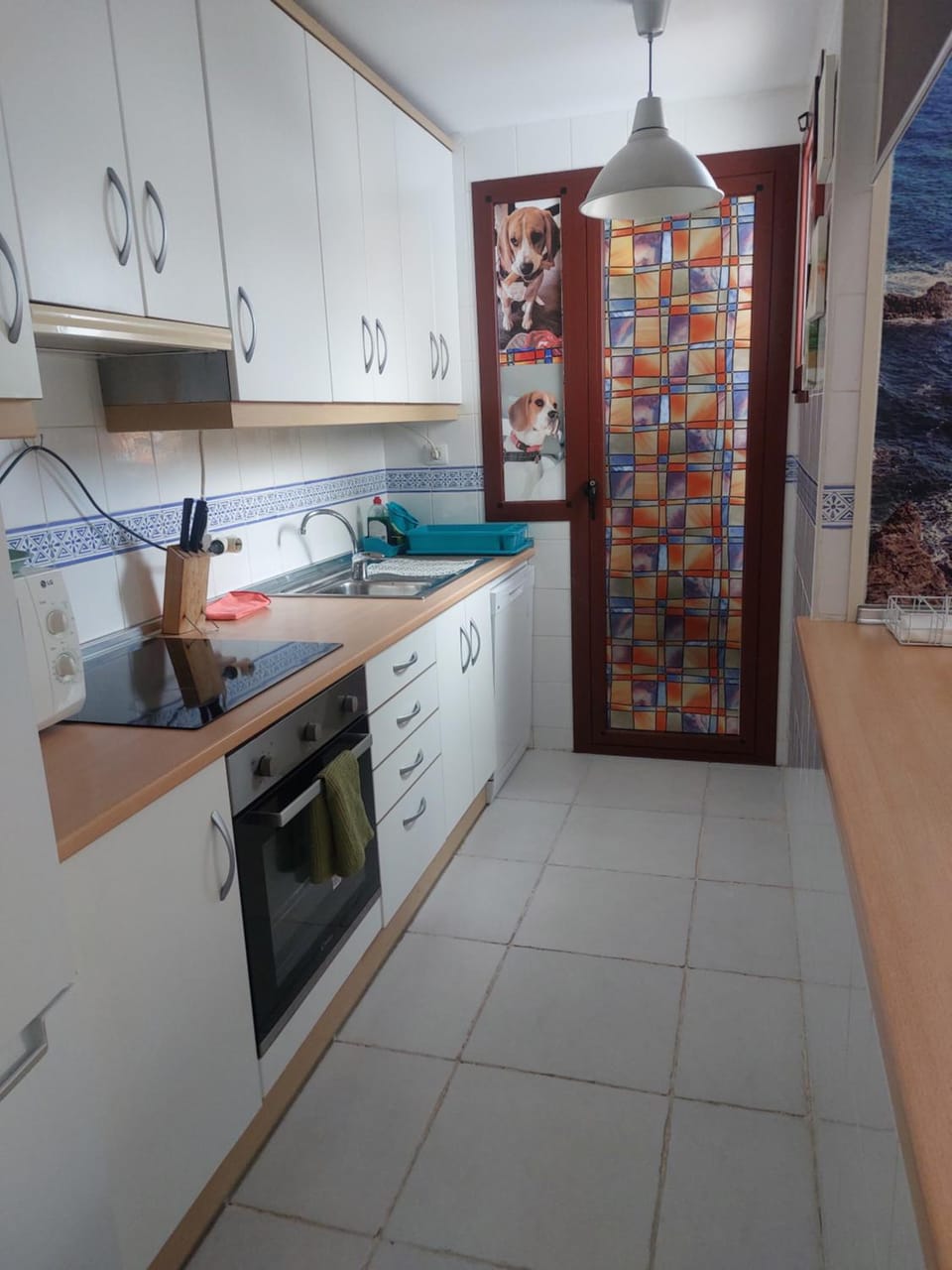 Kitchen or kitchenette, dishwasher, oven, stove, washing machine