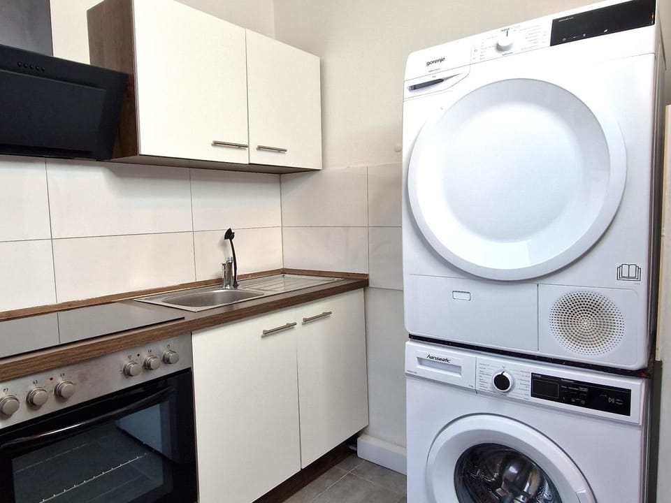 Kitchen or kitchenette, dishwasher, oven, stove, washing machine, dryer