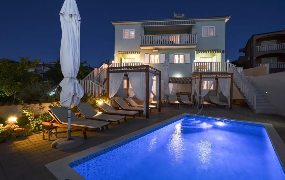 Property building, Patio, Night, Balcony/Terrace, Pool view, Swimming pool, sunbed