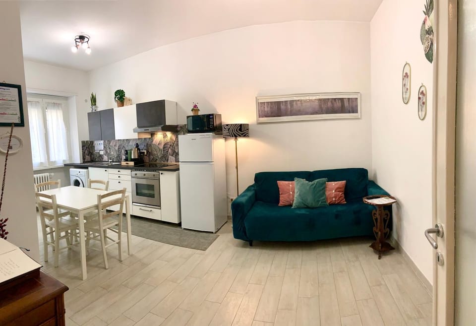 Communal lounge/ TV room, Living room, Seating area, furniture, microwave, oven, stove, washing machine, kitchen
