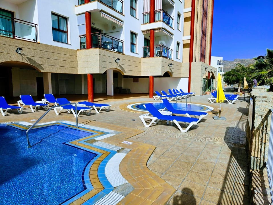 Property building, Pool view, Swimming pool, sunbed