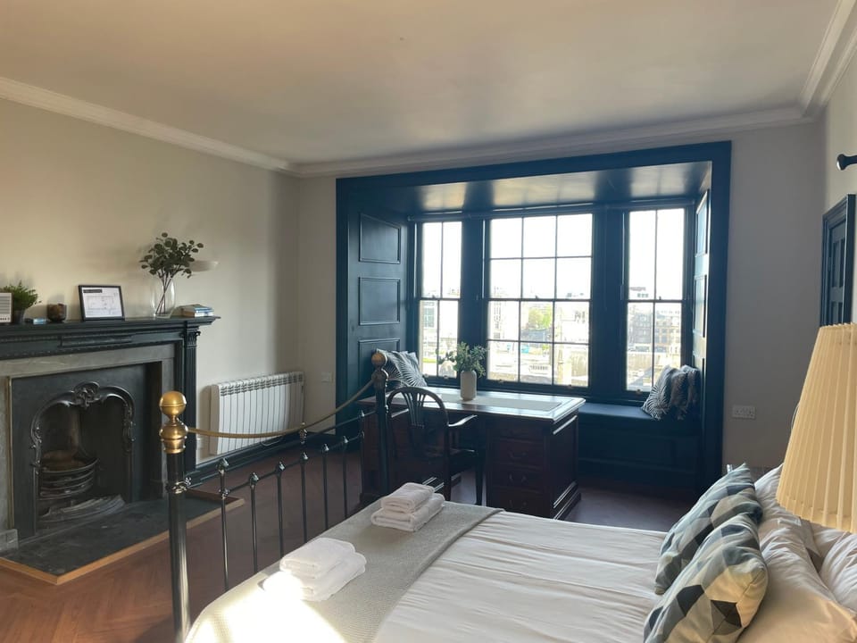 Bed, City view, fireplace