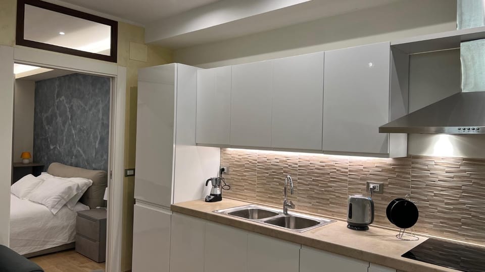 Bed, Kitchen or kitchenette, stove