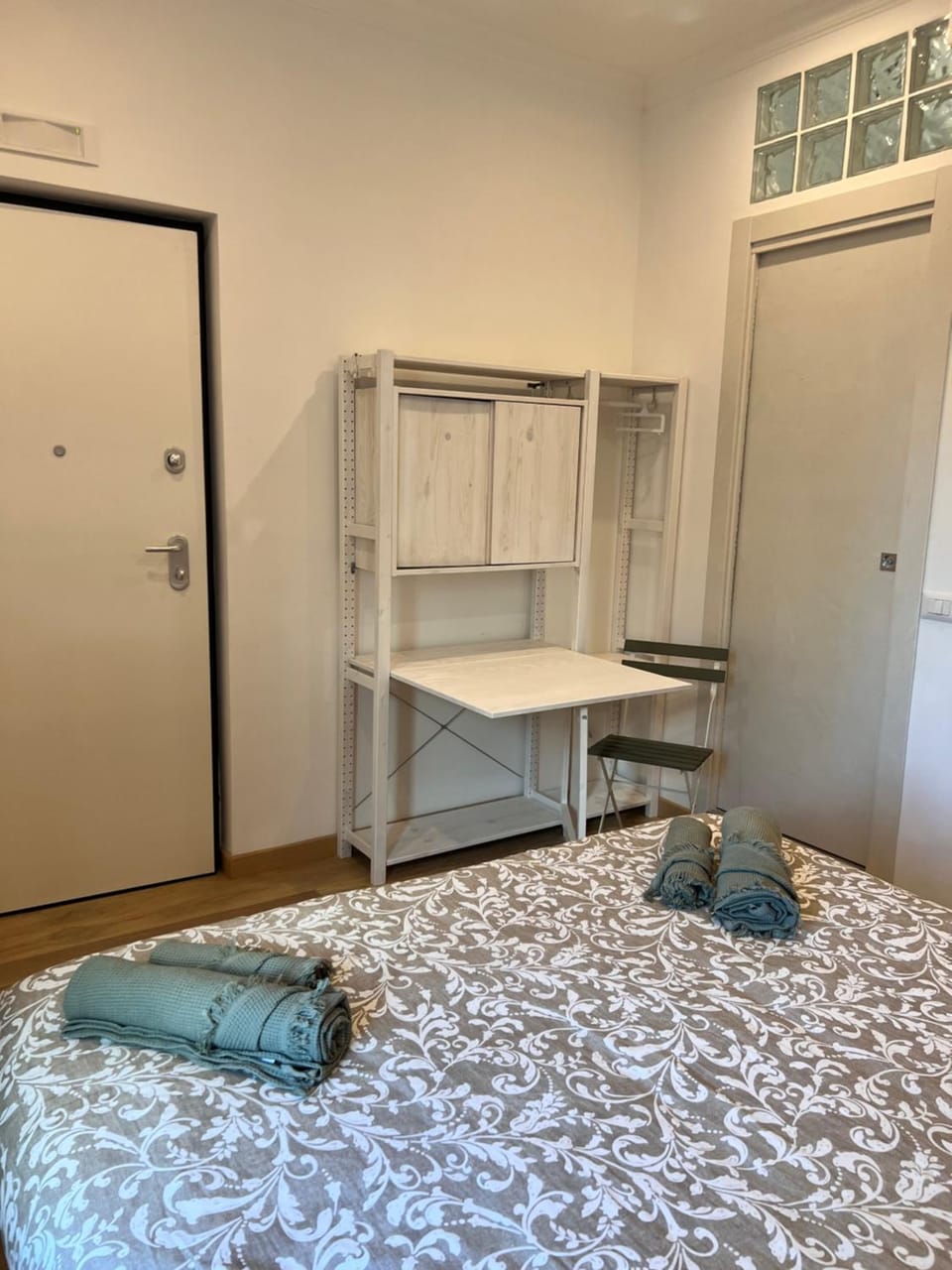 Photo of the whole room, hair dresser, towels, air conditioner