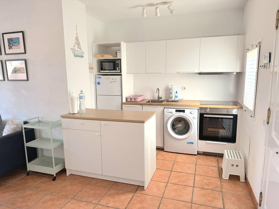 Kitchen or kitchenette, toaster, washing machine