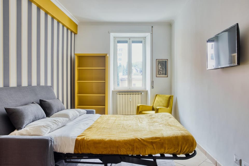 Bed, TV and multimedia, Living room, Seating area, Bedroom, hair dresser