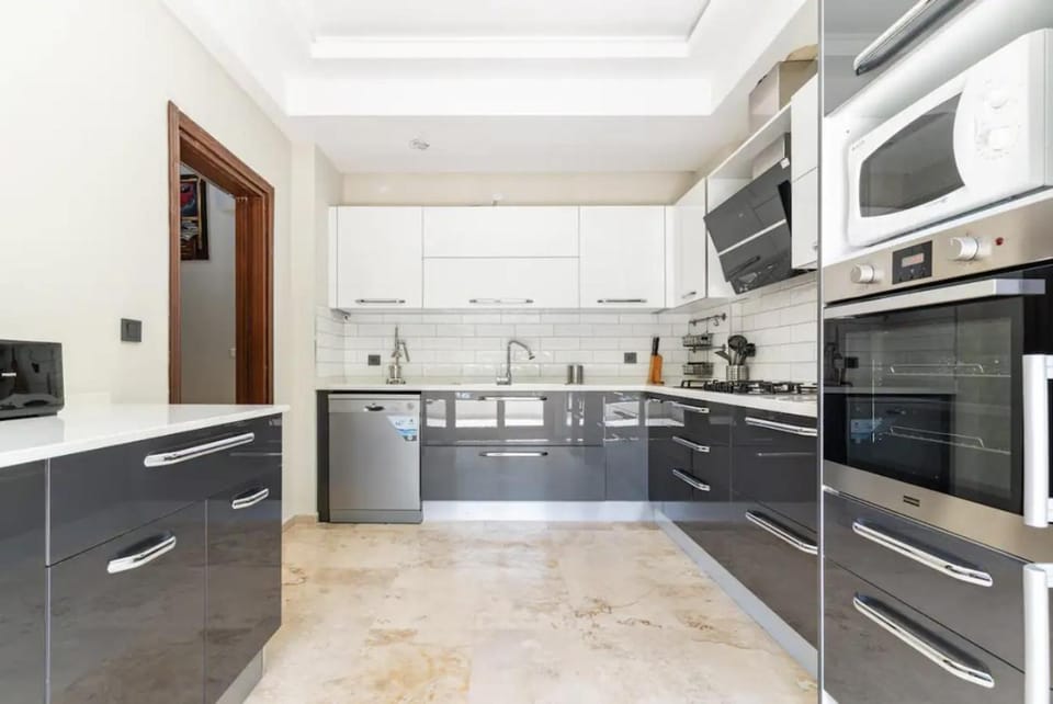 Kitchen or kitchenette, dishwasher, microwave, oven, toaster