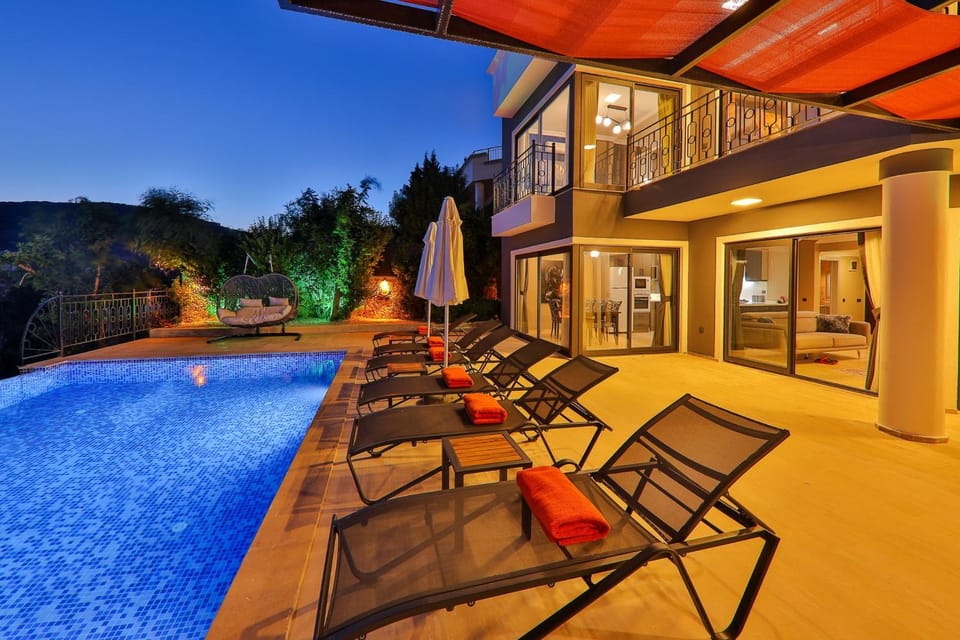 Property building, Patio, Night, Pool view, Swimming pool, sunbed