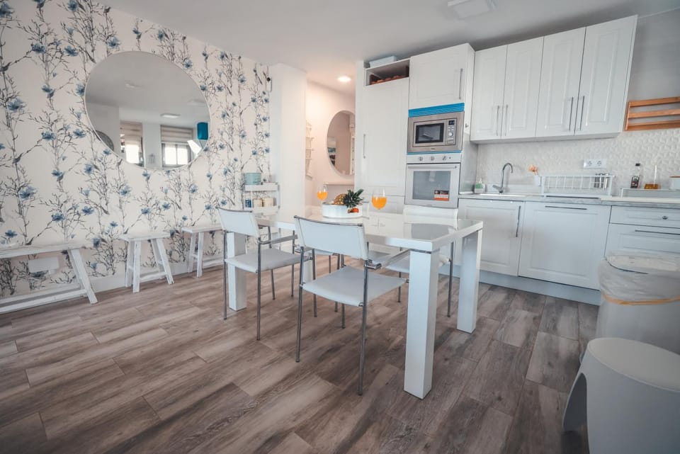 Kitchen or kitchenette, dishwasher, oven, stove