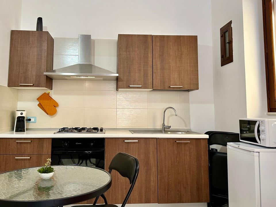 Kitchen or kitchenette, oven, stove