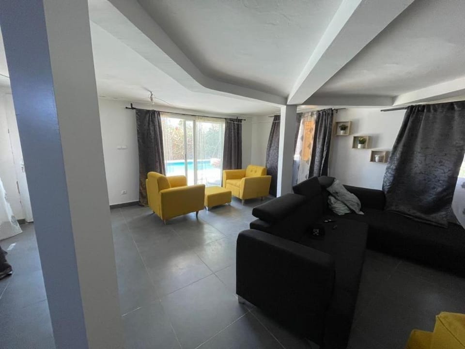Living room, Seating area, Pool view