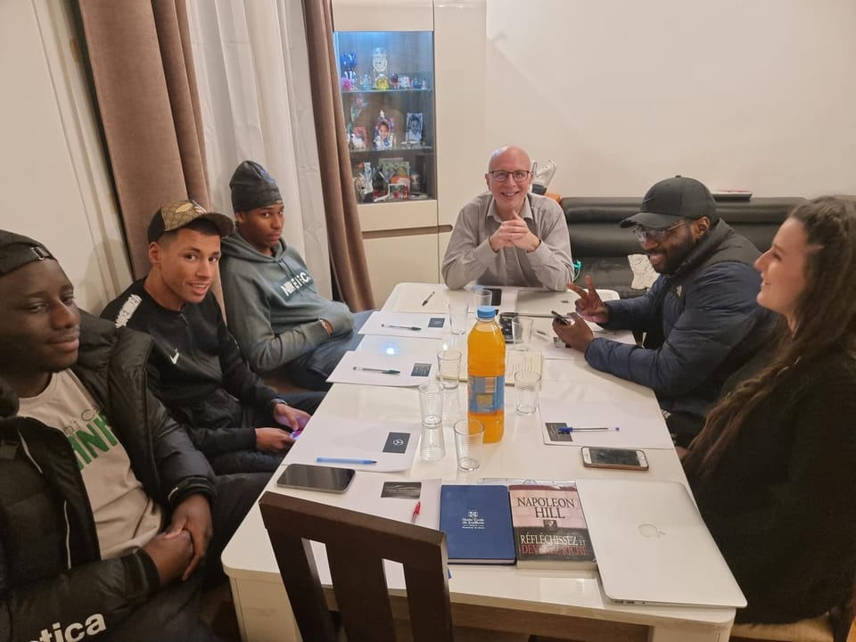 Communal lounge/ TV room, People, Living room, Seating area, group of guests