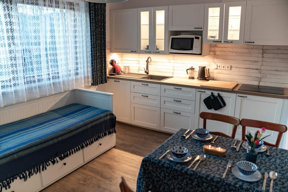 Bed, Seating area, Dining area, microwave, stove, kitchen