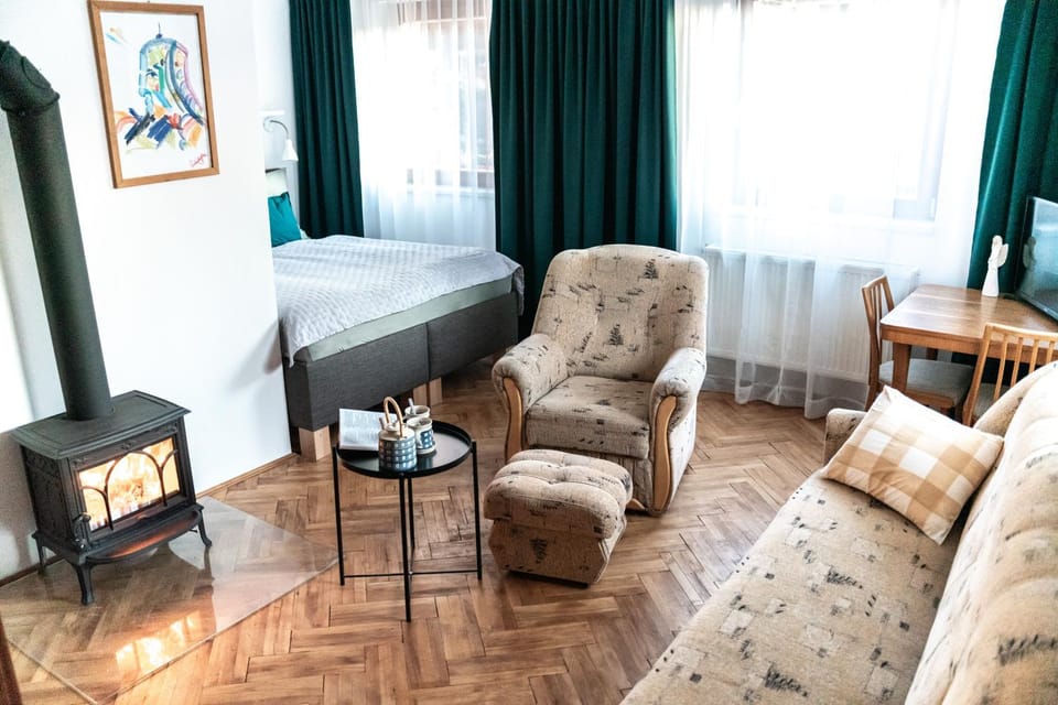 Bed, Living room, Seating area, Bedroom, fireplace