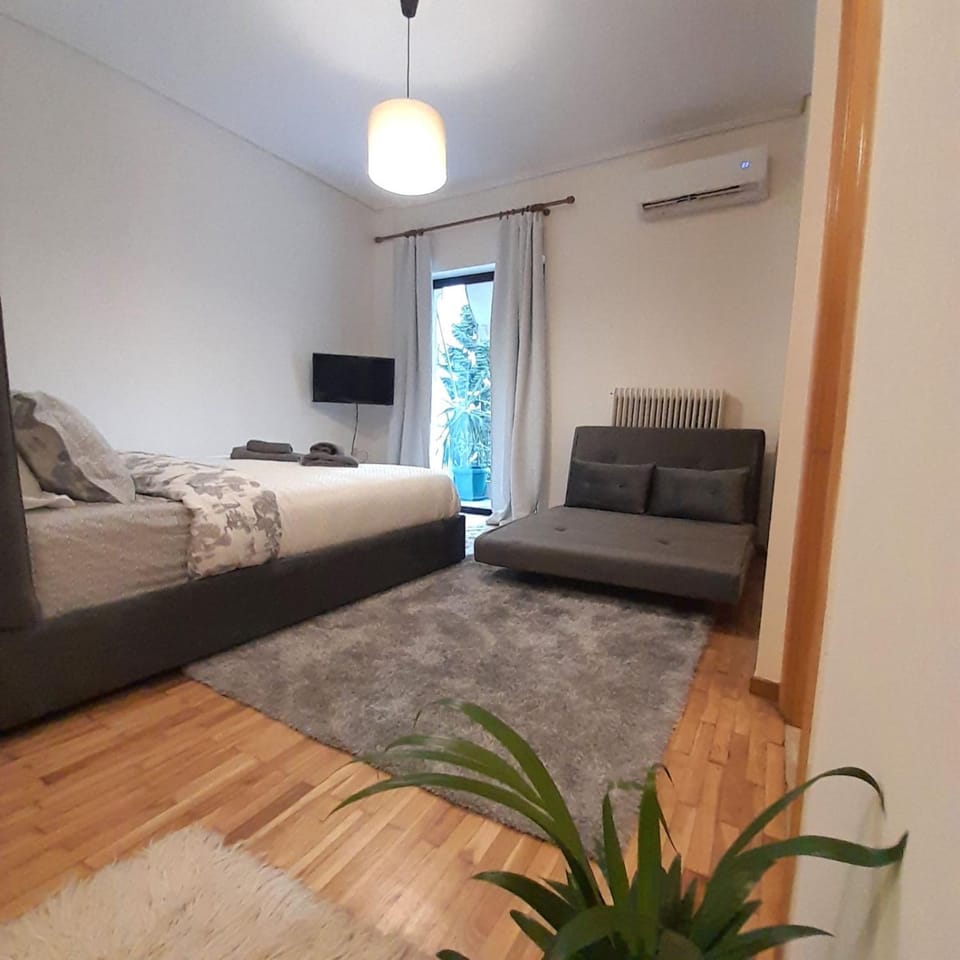 Bed, TV and multimedia, Seating area, Bedroom, air conditioner