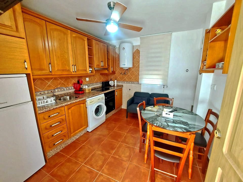 Kitchen or kitchenette, Dining area, oven, stove, toaster, washing machine