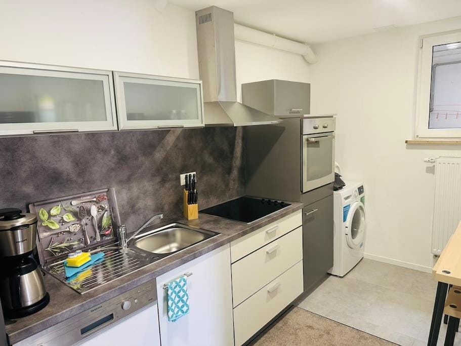 Kitchen or kitchenette, dishwasher, pet friendly, stove, toaster, washing machine, dryer